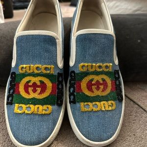 Authentic Gucci slide on tennis shoes.